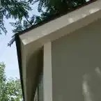 Installed Meridian 8 ft. x 10 ft. Wood Storage Shed with Autumn Brown Shingles